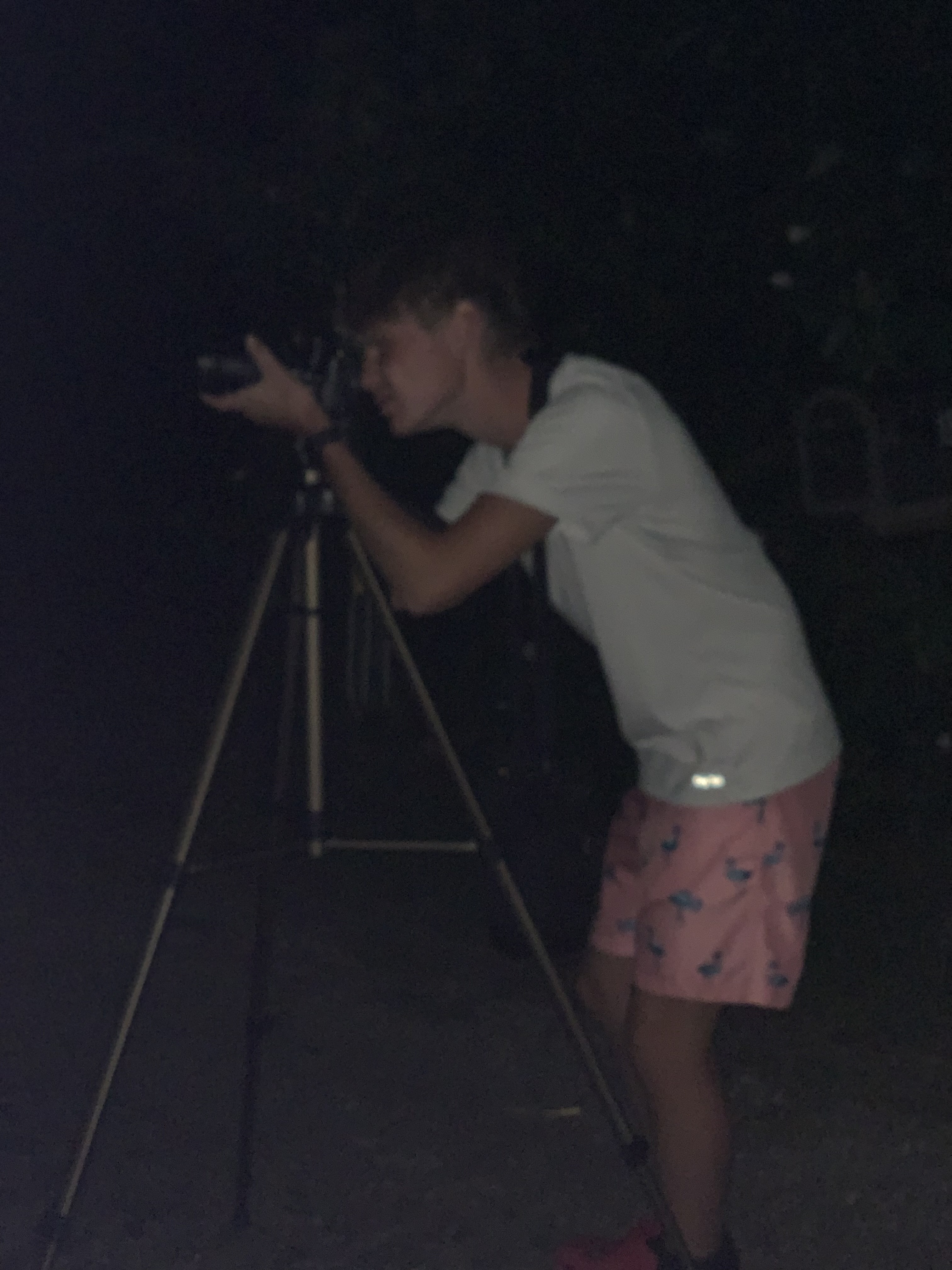 Henry taking a picture at night